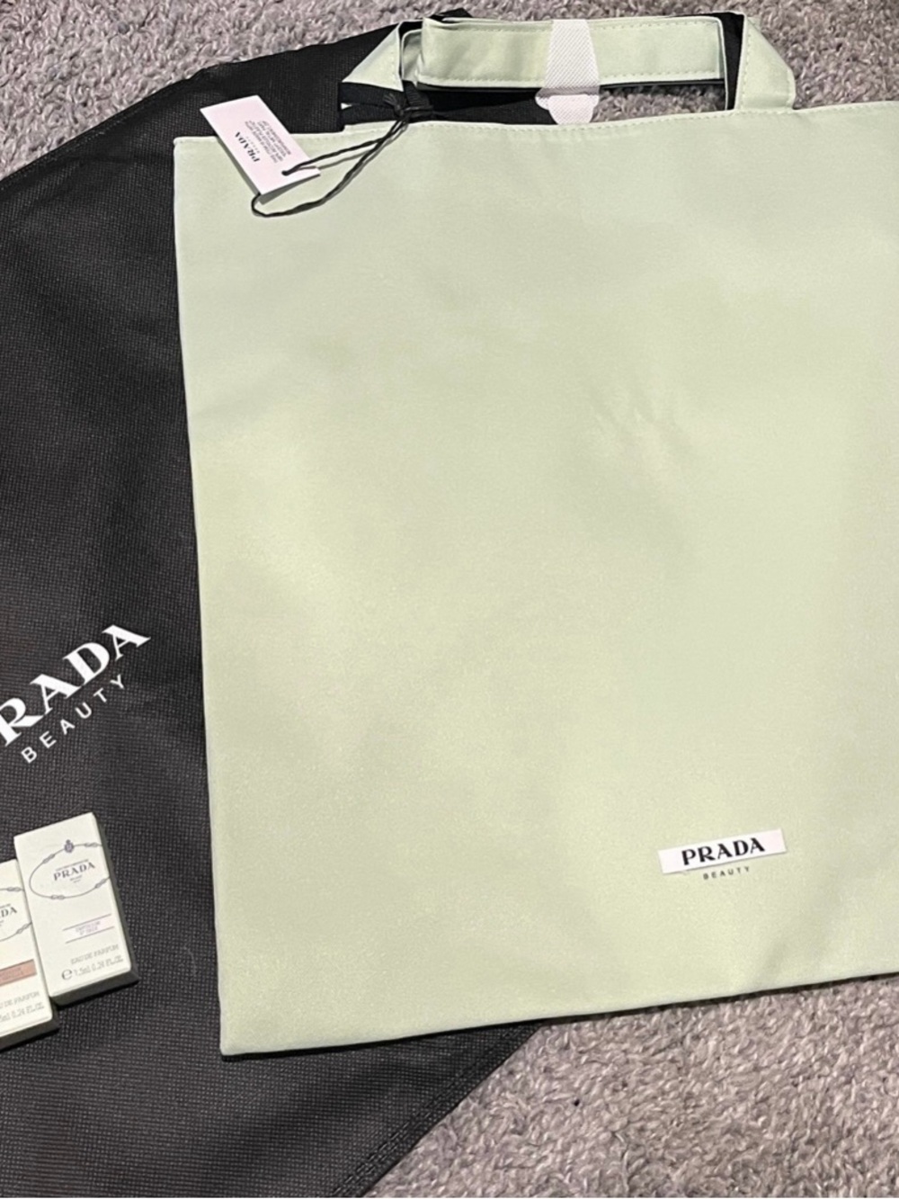 Prada Beauty Light Green Tote Bag with perfumes